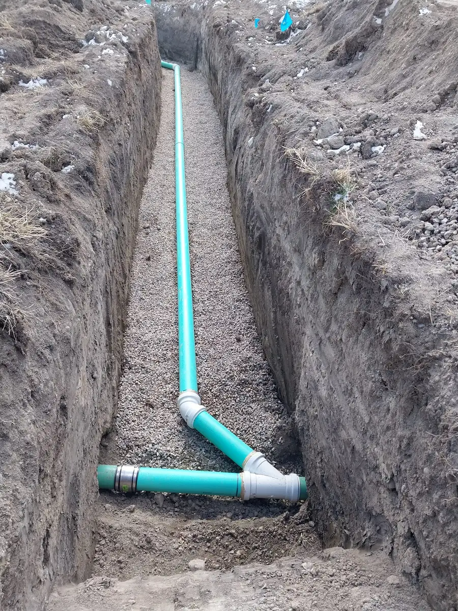 New sewer line with a wye fitting laid in a trench