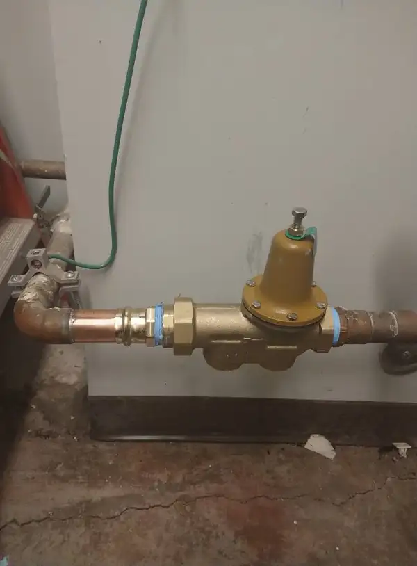 Pressure reducing valve installed on a main water line