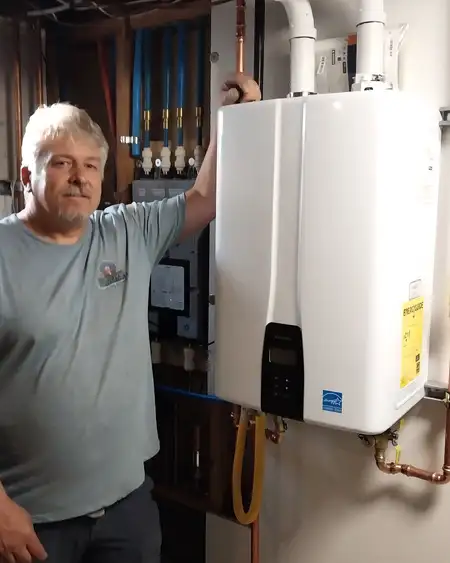 Jon Goble, owner of Eruption Plumbing & Drains, at a tankless water heater install