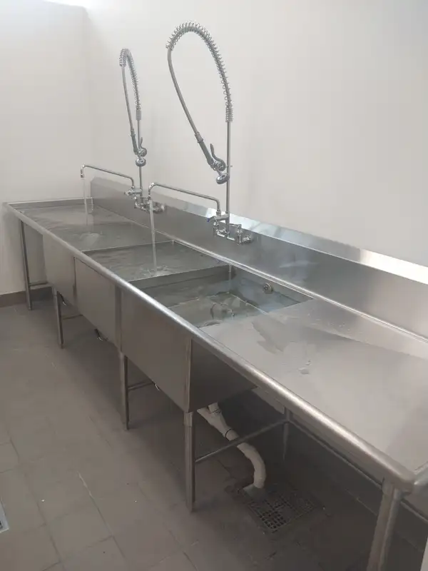 Commercial three-compartment stainless sink