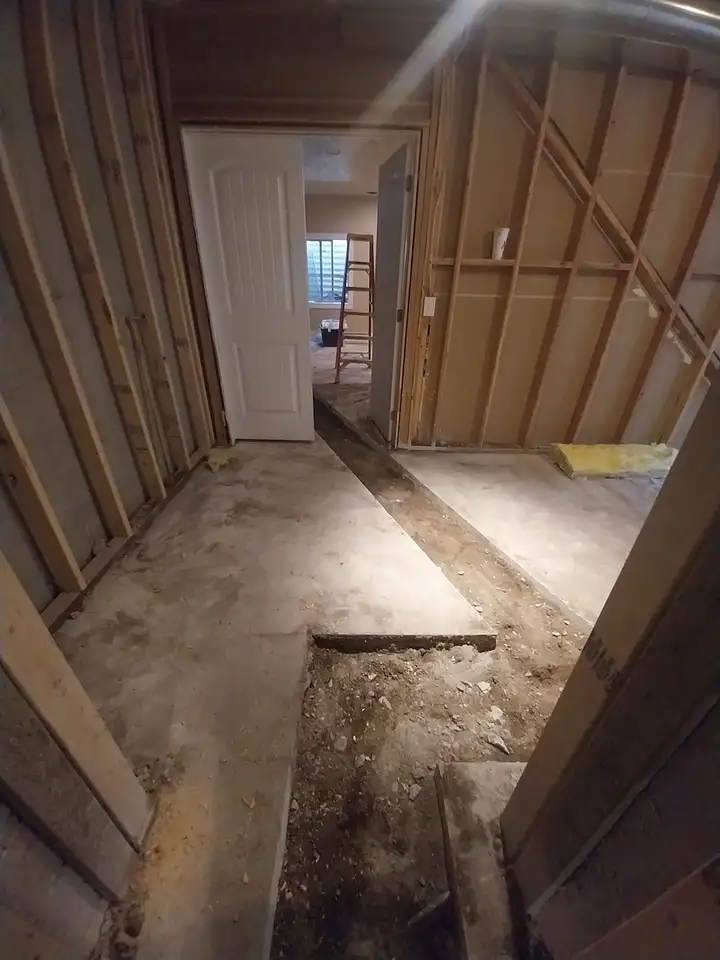 Basement floor cut open to repair a drain line under the slab