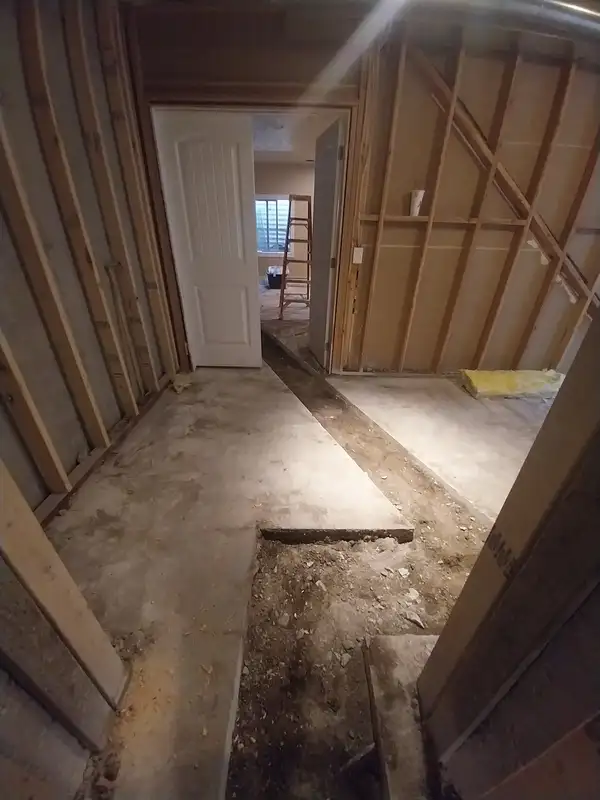 Basement floor cut open to repair a drain line under the slab