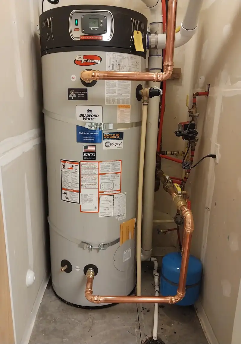 New high-efficiency gas water heater replacement with copper piping and expansion tank