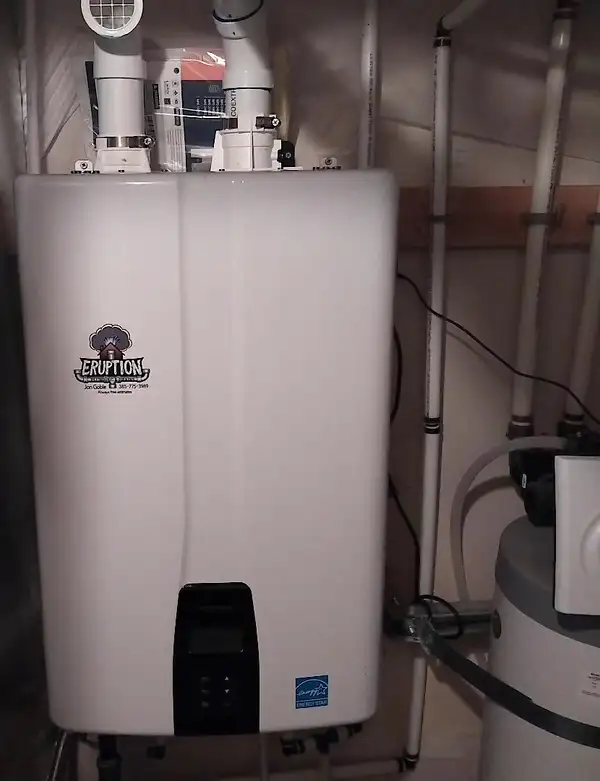 Wall-mounted tankless water heater with gas and water connections
